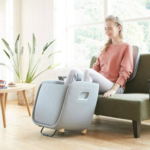 Load image into Gallery viewer, Women using rei Foot-Calf-Lumbar-Ottoman Massager
