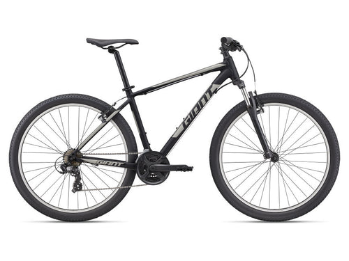 A black Giant brand mountain bike, model ATX 27.5, with aluminum frame and alloy wheels.