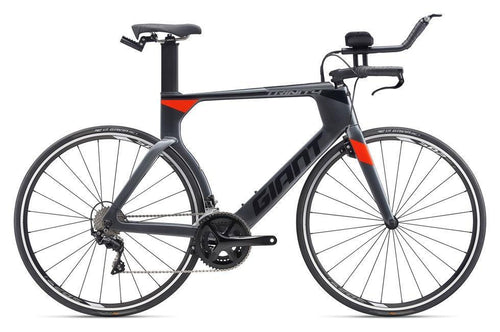 A black and gray Giant Trinity Advanced 2 bicycle with red accents, featuring a time trial design and equipped with Shimano and Tektro components.