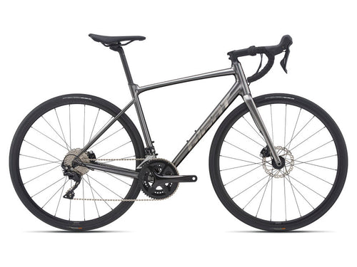 A charcoal-colored Giant road bicycle with disc brakes, featuring a Shimano 105 drivetrain and Giant P-R2 Disc wheelset.