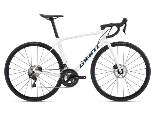 A white Giant road bicycle with disc brakes, featuring a carbon frame and Shimano 105 components.